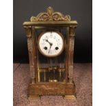 A French gilt brass four-glass mantle clock, with swagged enamel 8cm (3in) dial, glass front