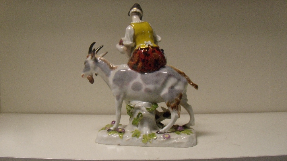 After Eberlein, a Meissen figure of the Tailor's wife, she suckles her child while riding a goat - Image 2 of 3