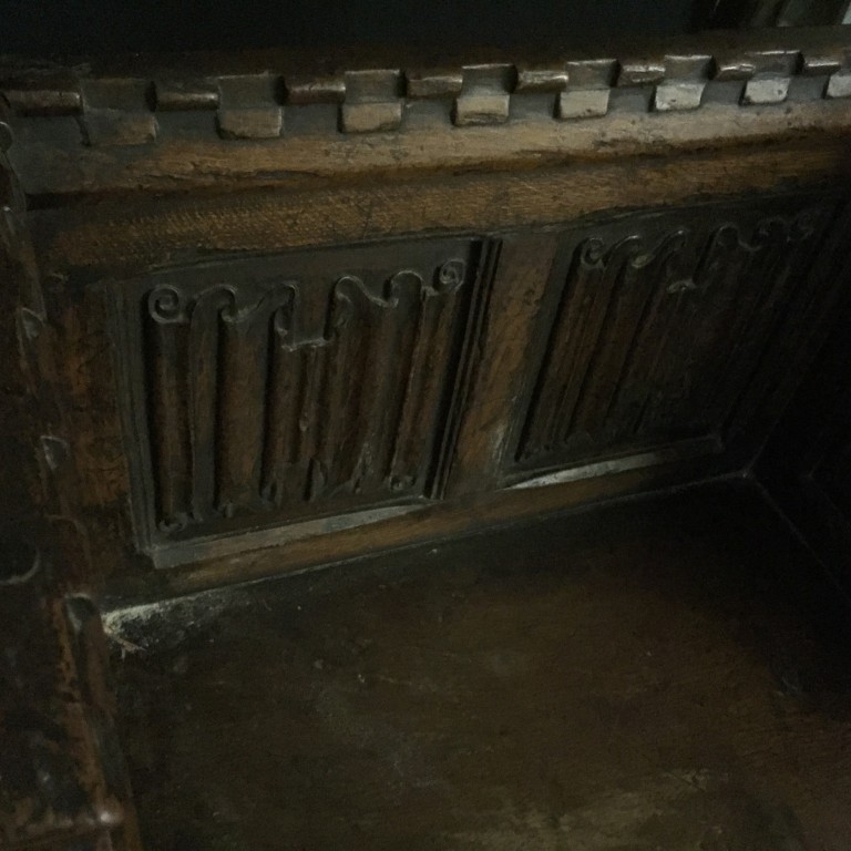 A Tudor revival oak pew seat, with castellated crest rail and linenfold panel back and sides, on - Image 2 of 3