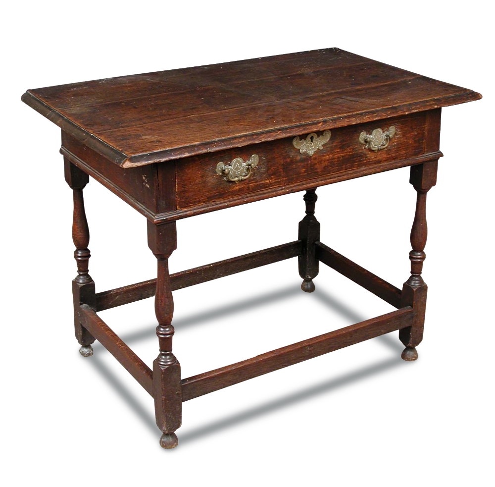 An early 18th century oak side table, with single drawer, engraved brass lock plate and handles on