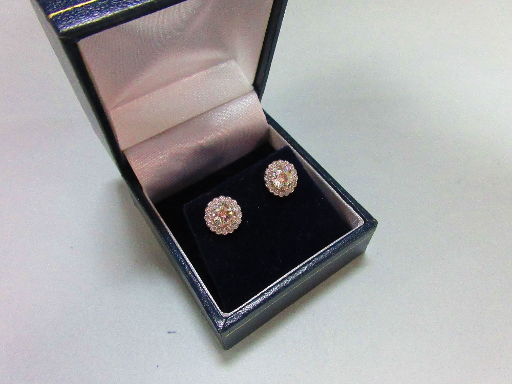 A pair of diamond cluster earstuds, each designed as a four claw set principal round brilliant cut - Image 3 of 3