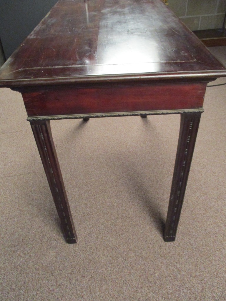A small George III mahogany serving table, with later carved decoration, on chamfered square section - Image 2 of 2