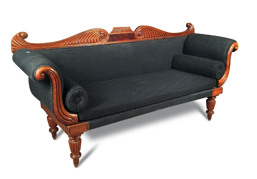 A late Regency mahogany sofa, scroll and gadroon carved show wood, upholstered in a black fabric