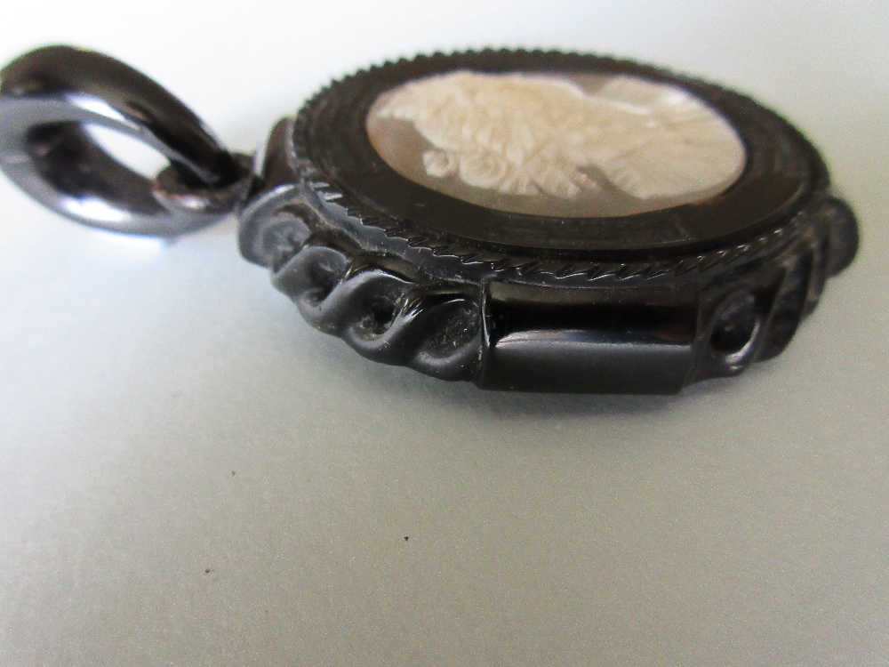 A Victorian carved jet mounted shell cameo pendant, the white on grey cameo depicting a Bacchante in - Image 2 of 6