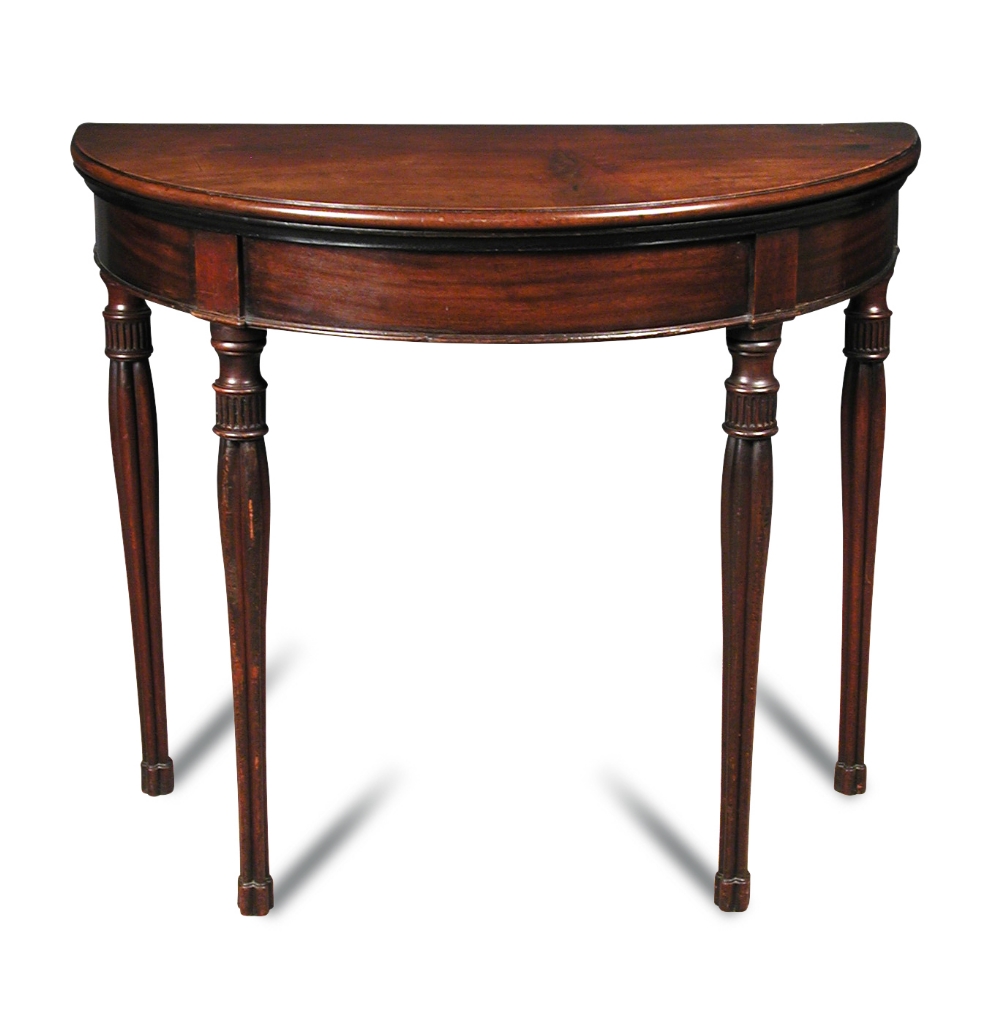 A George IV mahogany demi lune card table, with foldover top, green velvet lined interior, on