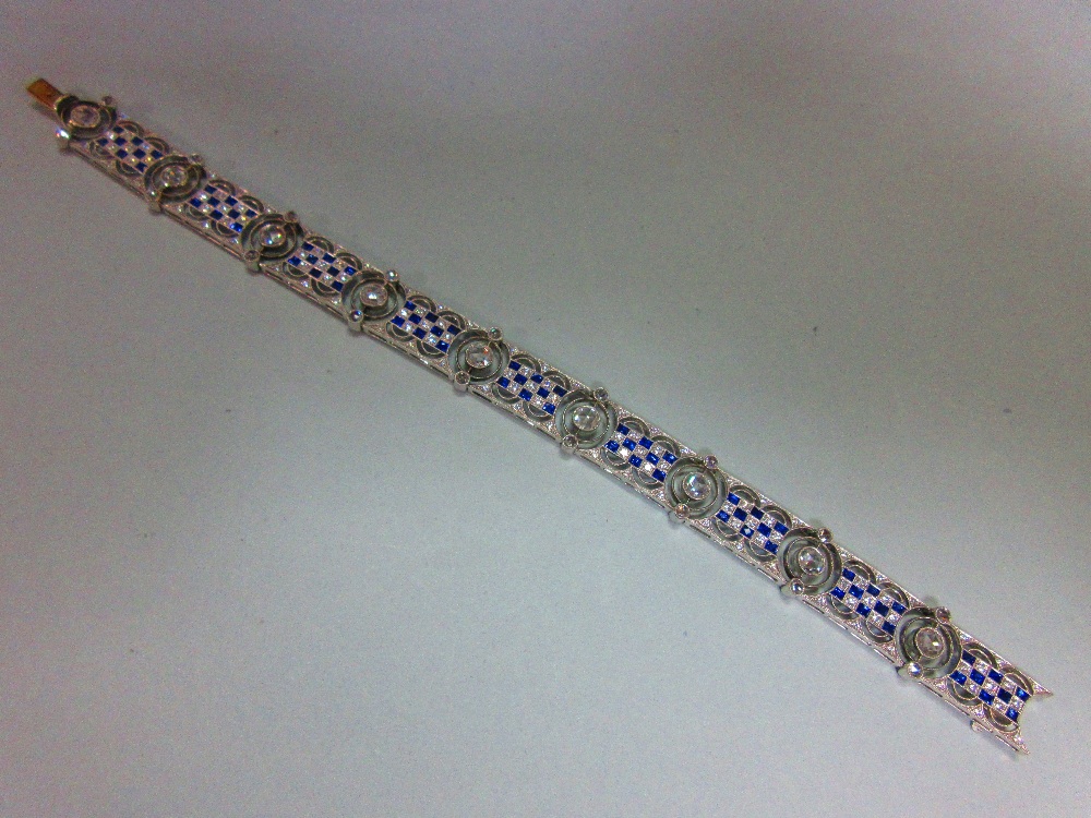 An art deco diamond and sapphire bracelet, designed as nine geometric pierced panels with a - Image 8 of 8