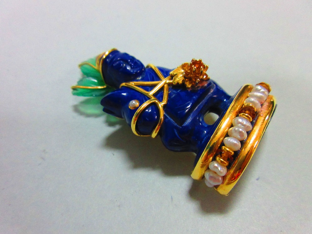 A Seaman Schepps carved lapis lazuli and gemset figurative brooch, the lapis carved as a figure on - Image 2 of 7