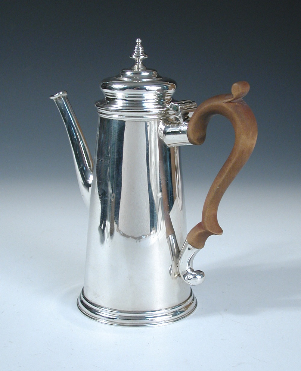 An 18th century style silver coffee pot, by Charles Stuart Harris & Sons, London 1913, of plain