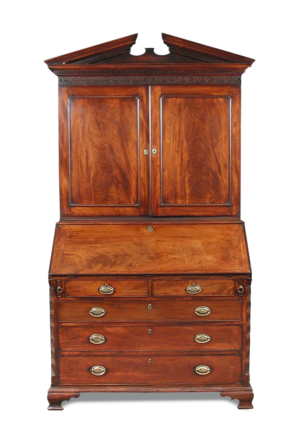 A George III mahogany bureau bookcase, circa 1770 with breakarch pediment, dentil cornice with blind