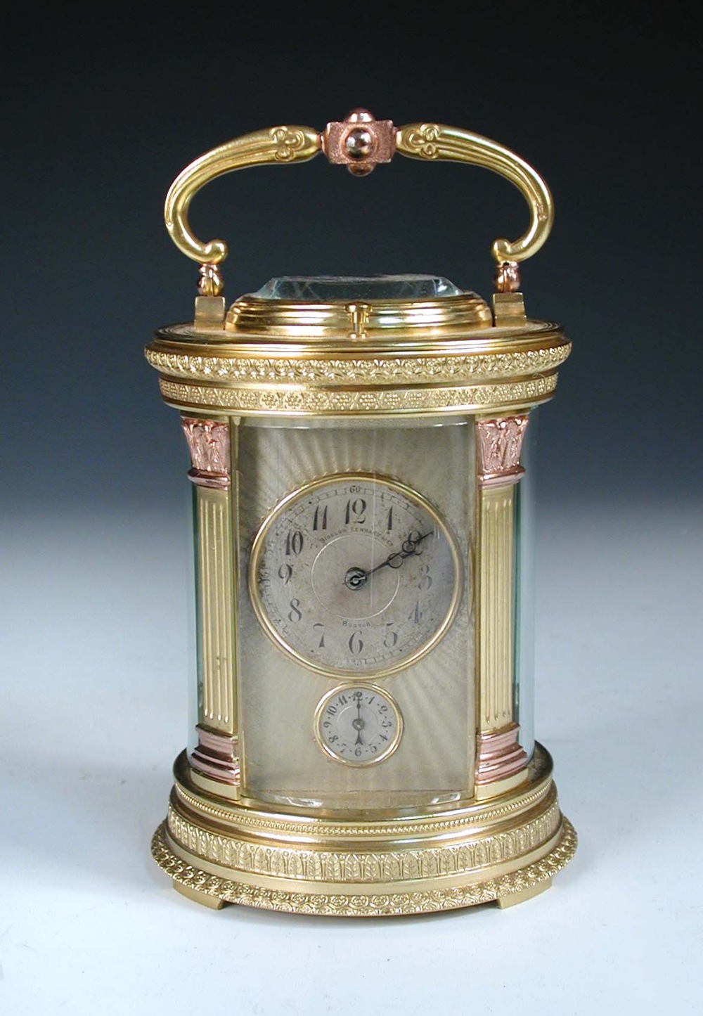 A French cylinder shaped gilt brass repeating carriage clock, circa 1900, the circular silvered dial