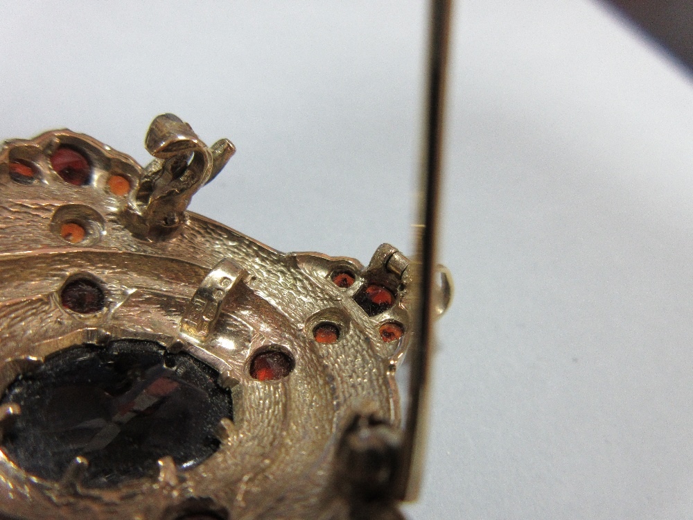 A gold and garnet Holbeinesque pendant / brooch, of oval tiered form, set to the cardinal points - Image 5 of 6
