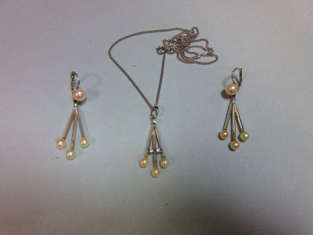 An Italian 18ct white gold and pearl earring and necklace suite, the earrings with hook and snap