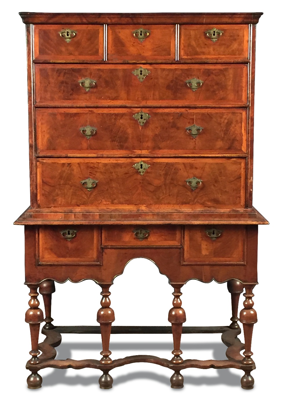 An early 18th century walnut chest on stand, banded border decoration to the drawer fronts and