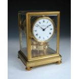 An early Atmos mantle clock by J. L. Reutter, serial no. 123, the bevelled glazed gilt frame case