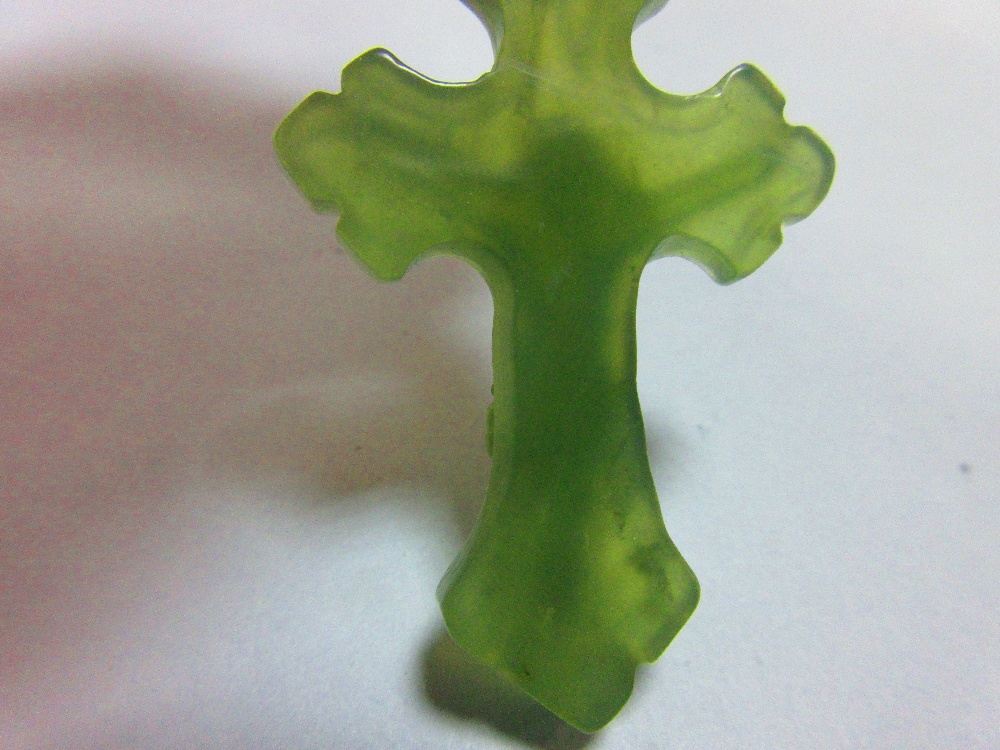 A carved green hardstone crucifix pendant, the treflee form cross with incised edge decoration and - Image 4 of 5