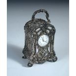 A Continental silver cased miniature carriage timepiece, with inset mother-of-pearl front panels,