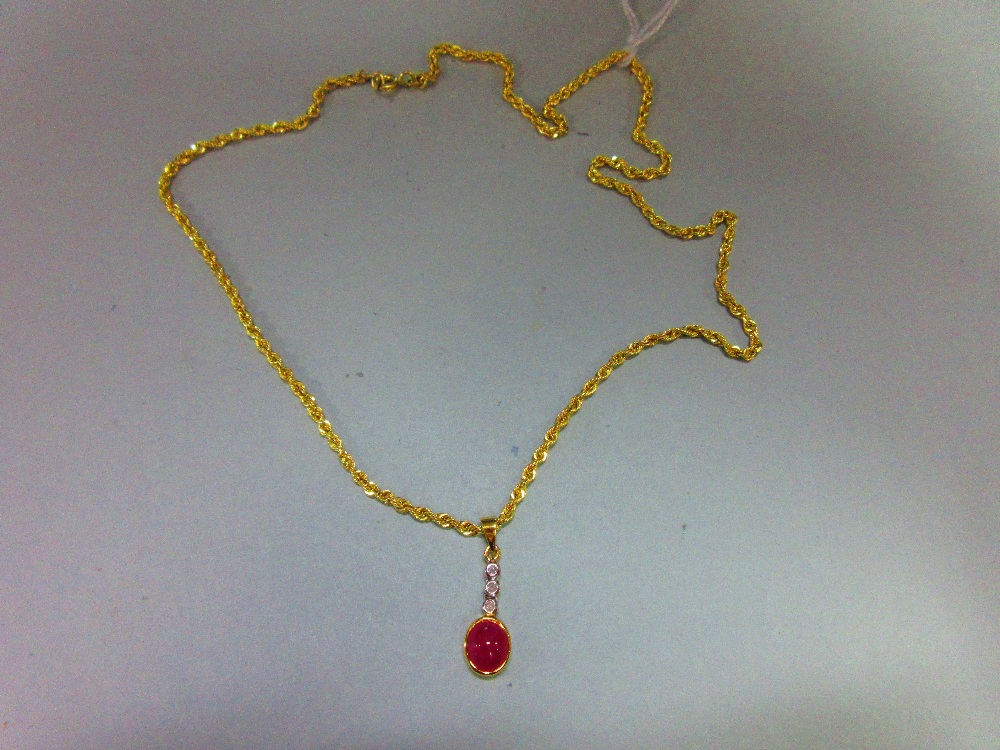 A ruby and diamond pendant with gold chain, the pendant designed as an articulated line of collet