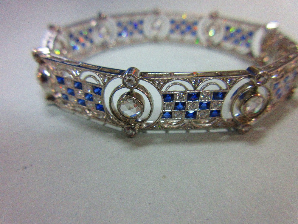 An art deco diamond and sapphire bracelet, designed as nine geometric pierced panels with a - Image 3 of 8