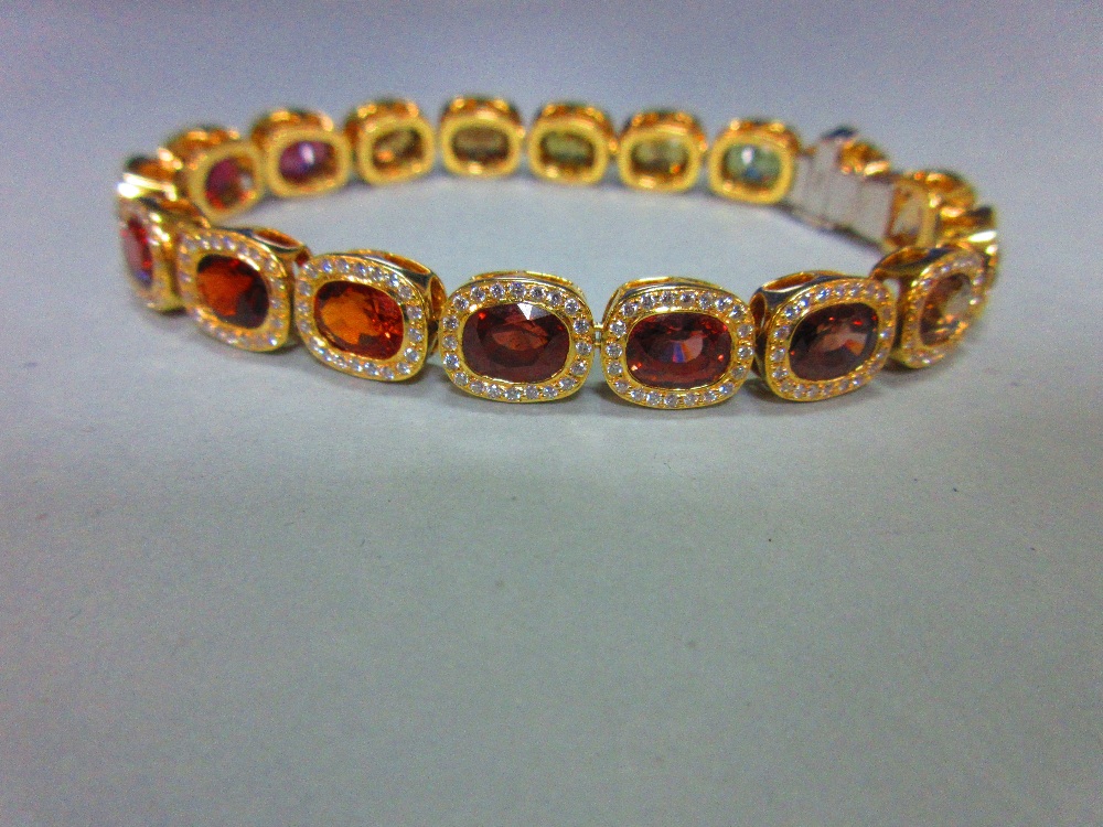 A multi gem set and diamond bracelet, each of the eighteen oval cut stones set in a border of - Image 8 of 8