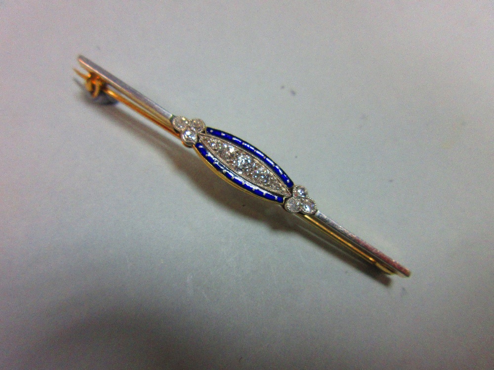 A diamond and enamel bar brooch, set to the centre with a graduated line of five old round brilliant - Image 4 of 4