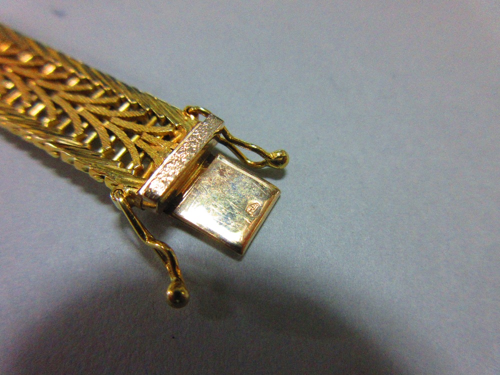 An Austrian 14ct gold bracelet, the delicate pierced polished and textured ribbon band, width 1cm, - Image 5 of 5