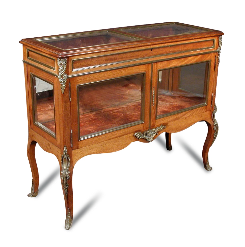 A French Transitional style mahogany and gilt mounted vitrine, circa 1900, the hinged glazed top