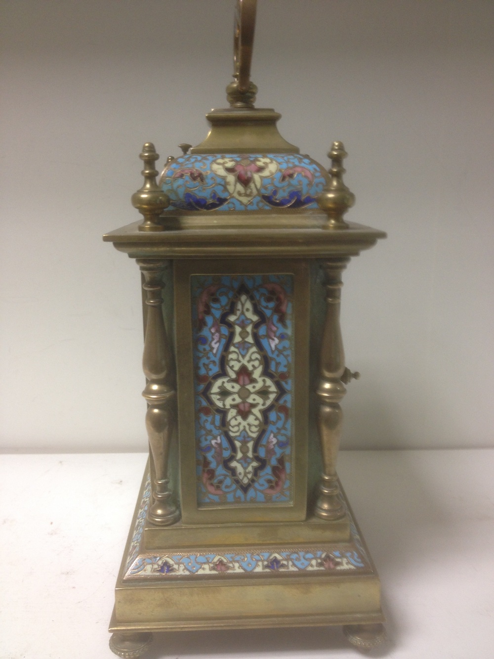 A late 19th century brass and enamelled mantle clock, with folding handle above repeat button, - Image 3 of 5