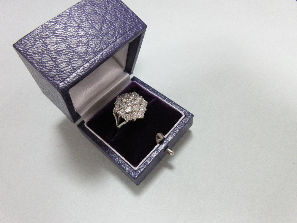 A diamond cluster ring set in 18ct gold, closely set with nineteen round brilliant cut diamonds in a - Image 5 of 6