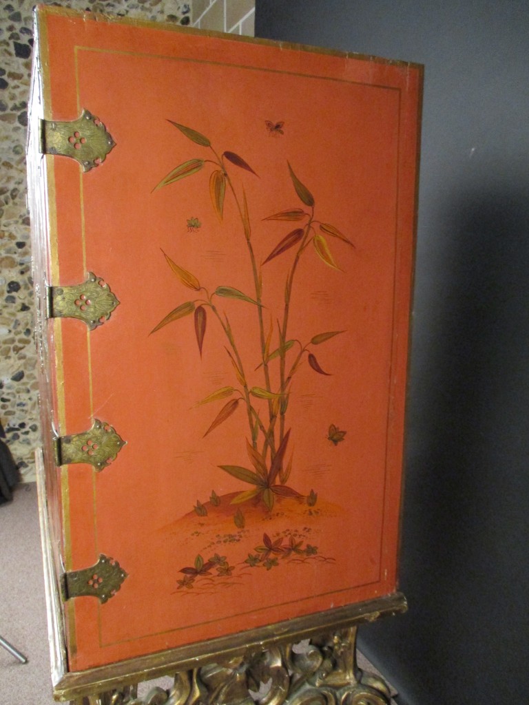 An 18th century Chinese red lacquer cabinet on a giltwood stand, decorated with a traditional - Image 2 of 9