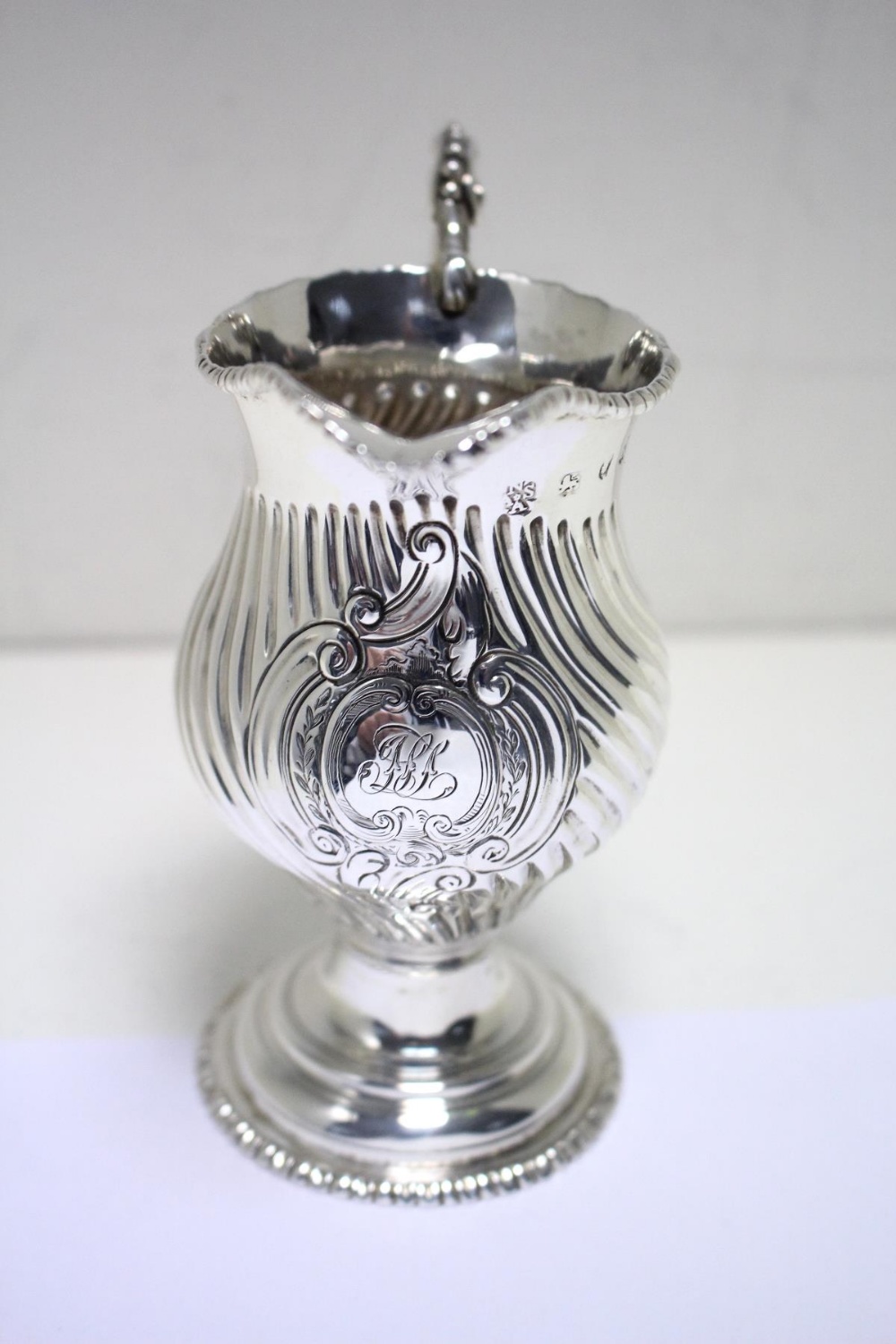 A George III silver creamer by Nathaniel Appleton & Ann Smith, London 1772, pyriform, the body - Image 2 of 5