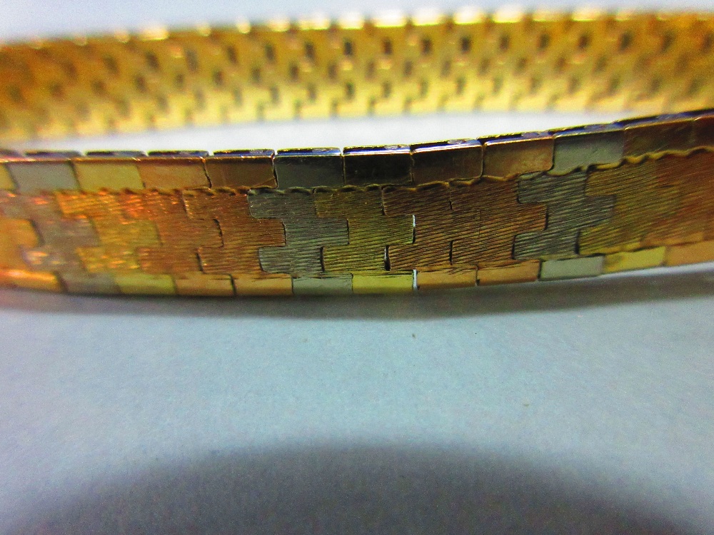 An Italian 18ct tri-coloured gold bracelet, the smooth ribbon of interlocking white, rose and yellow - Image 5 of 5