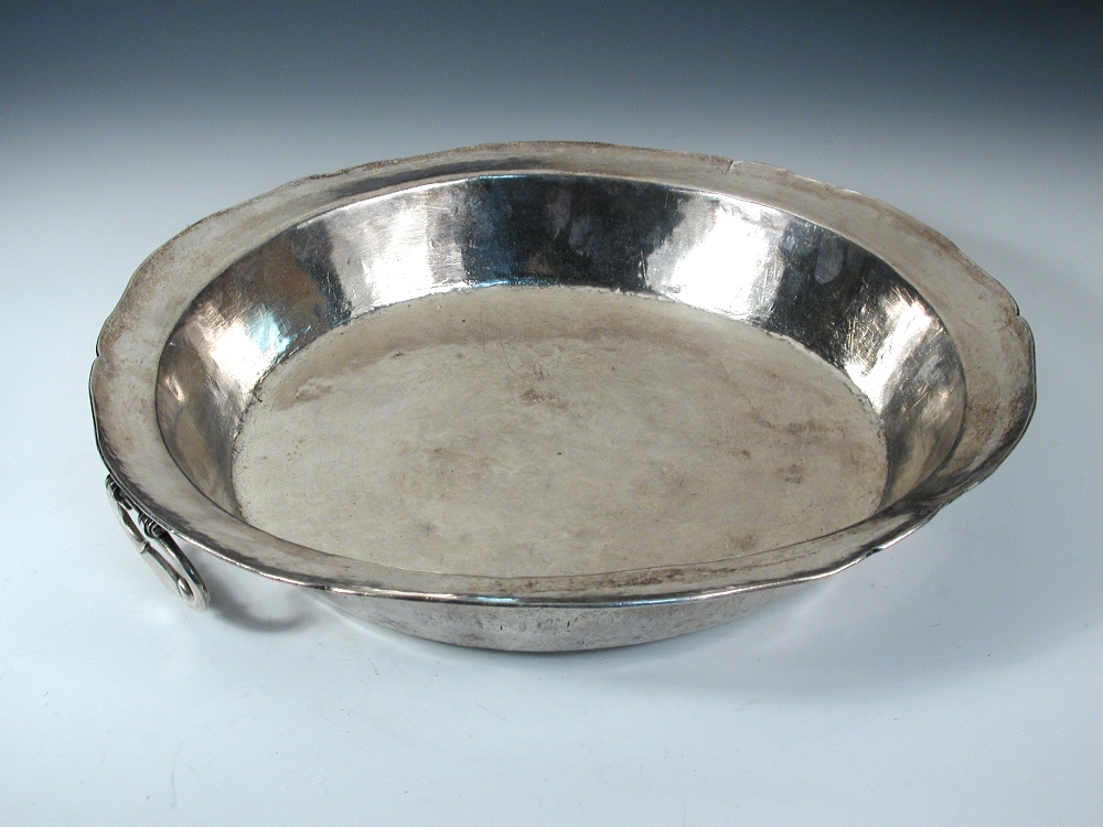 A large shallow metalwares two handled cooking pan, unmarked but believed to be Peruvian, with
