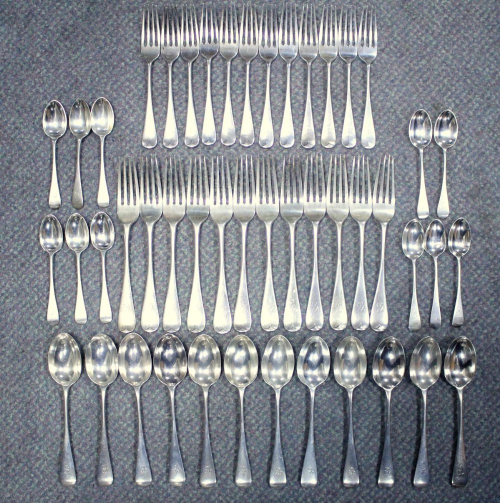A late Victorian silver Old English pattern flatware service, mostly by Wakely & Wheeler, London