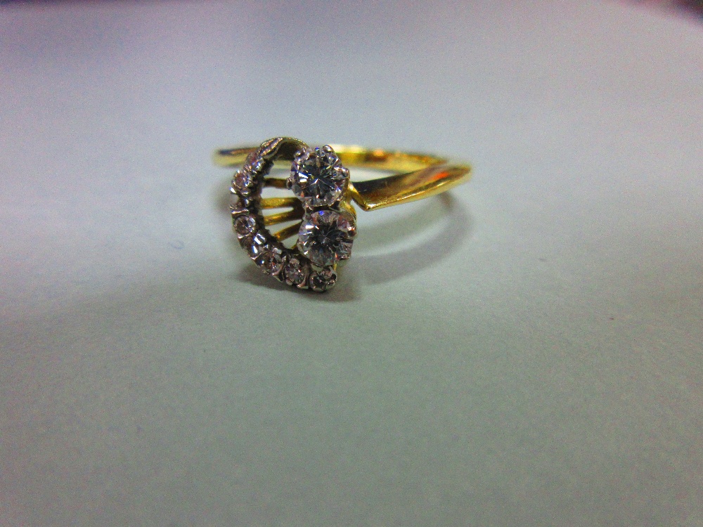 An asymmetric diamond ring set in 18ct gold, designed with two principal round brilliant cut - Image 5 of 5