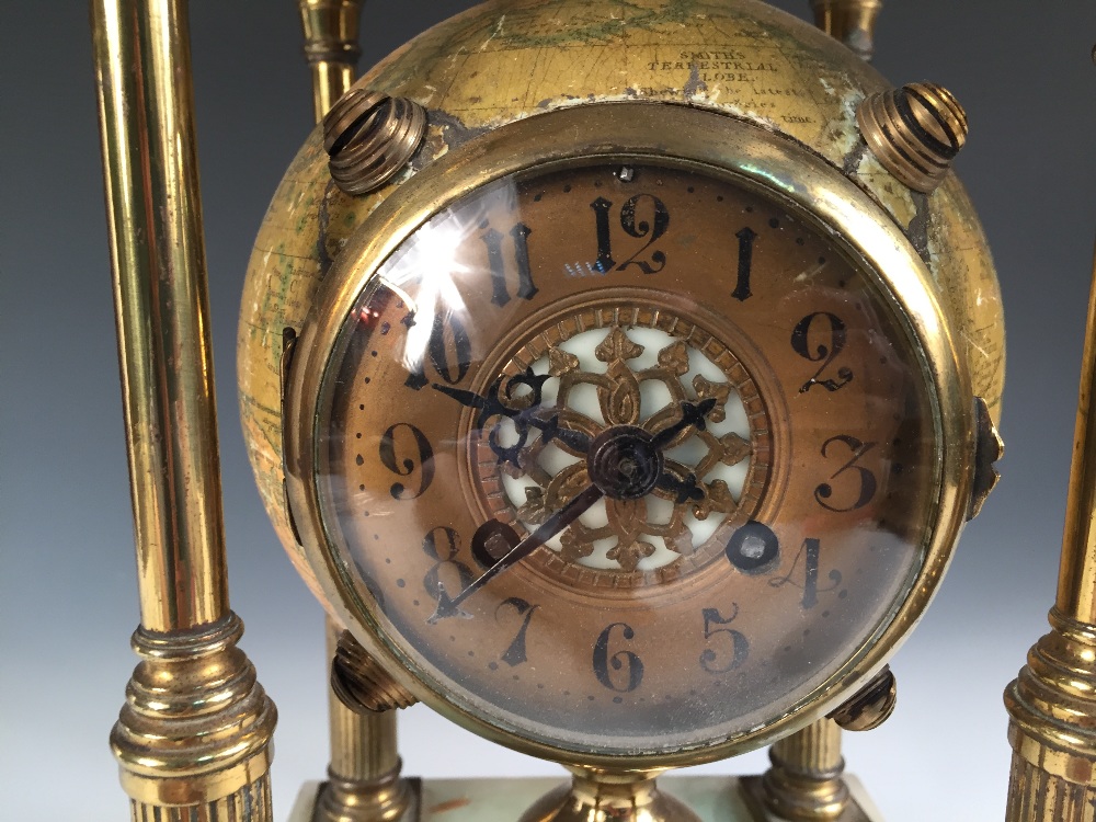 A novelty mantle clock, with movement mounted within a Smith's terrestrial 6 inch globe, to a gilt - Image 2 of 3