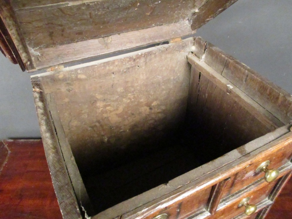 A small 17th century oak chest, a hinged top with false drawer fronts and brass handles, on later - Image 3 of 5