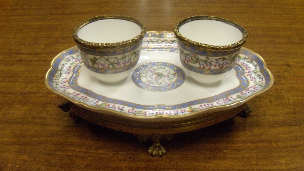 A Sevres double bowled preserve dish, date code for date letters for 1786, on later ormolu stand,