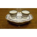 A Sevres double bowled preserve dish, date code for date letters for 1786, on later ormolu stand,