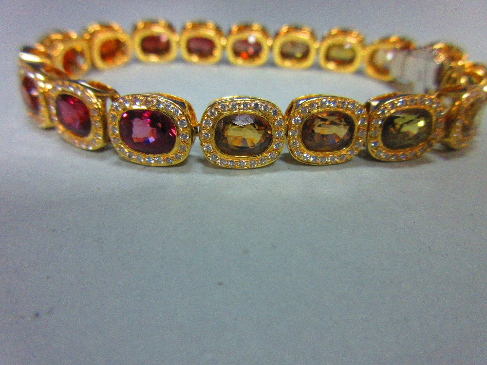 A multi gem set and diamond bracelet, each of the eighteen oval cut stones set in a border of - Image 3 of 8