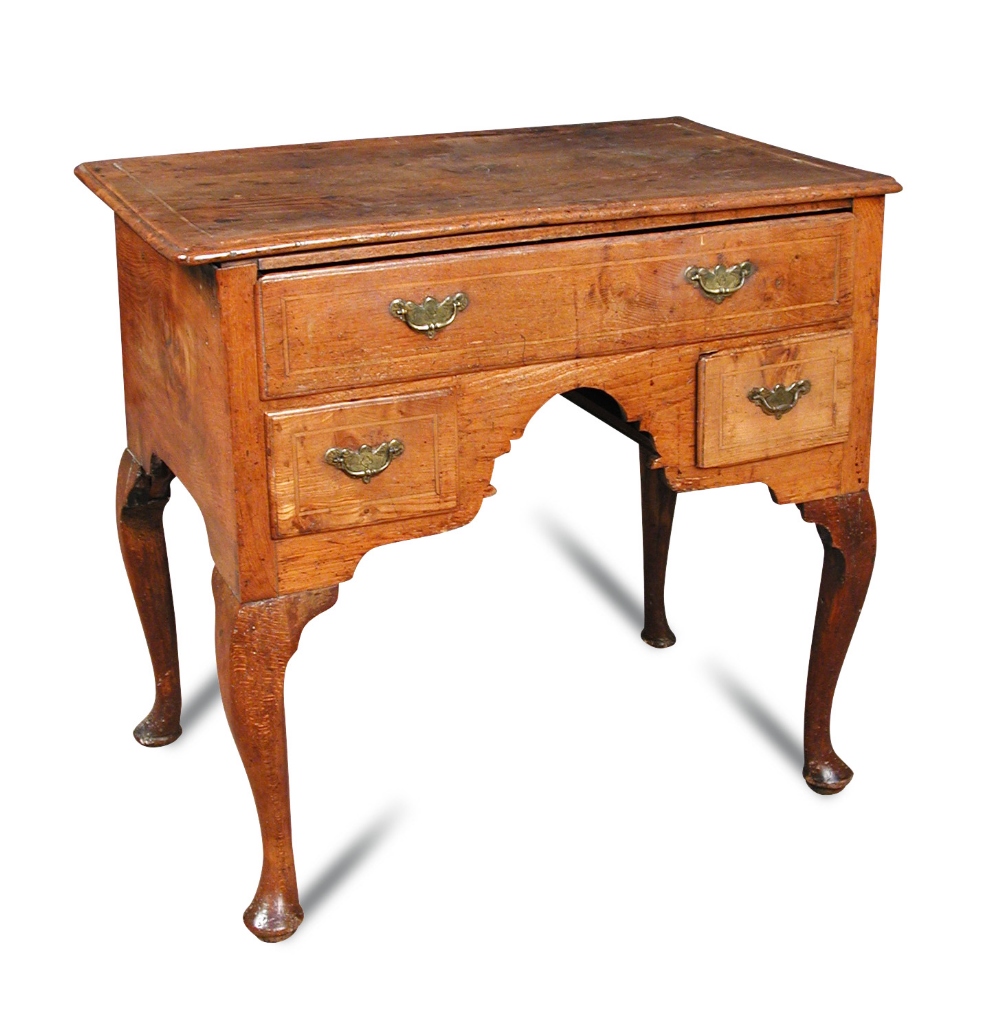 An early 18th century oak lowboy, boxwood line inlaid border decoration, fitted one long and two