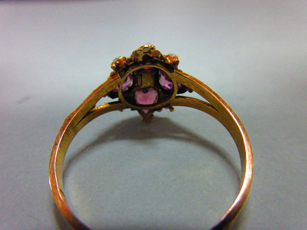 A mid Victorian 15ct gold, garnet and seed pearl quatrefoil ring, with four heart cut almandine - Image 4 of 6