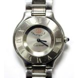 By Cartier - a gentleman's stainless steel 'Must de Cartier 21' quartz bracelet watch. The plain