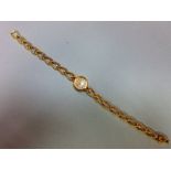 A Jaeger-LeCoultre lady's 18ct gold wristwatch with diamond set bracelet, the small circular cream