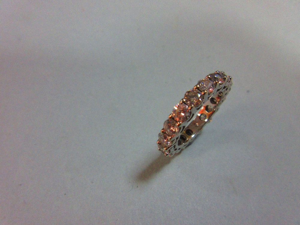 A diamond full hoop eternity ring, set with eighteen round brilliant cut diamonds in white - Image 3 of 5