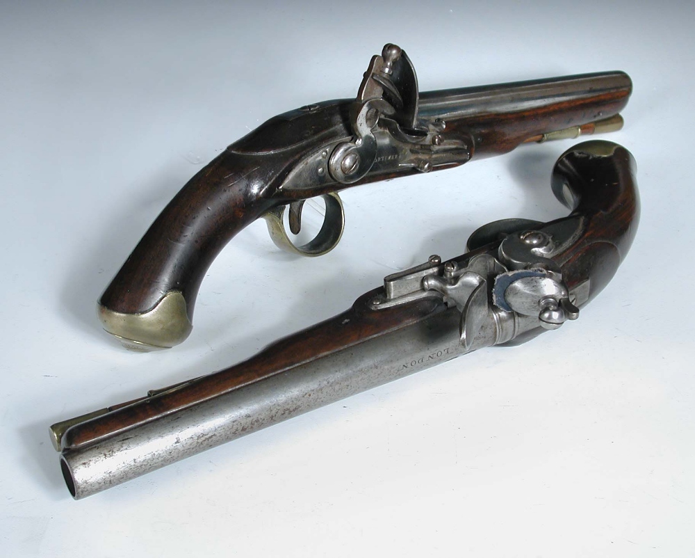 A composed pair of flintlock pistols marked Mortimer, each with 9 inch steel barrels, one marked