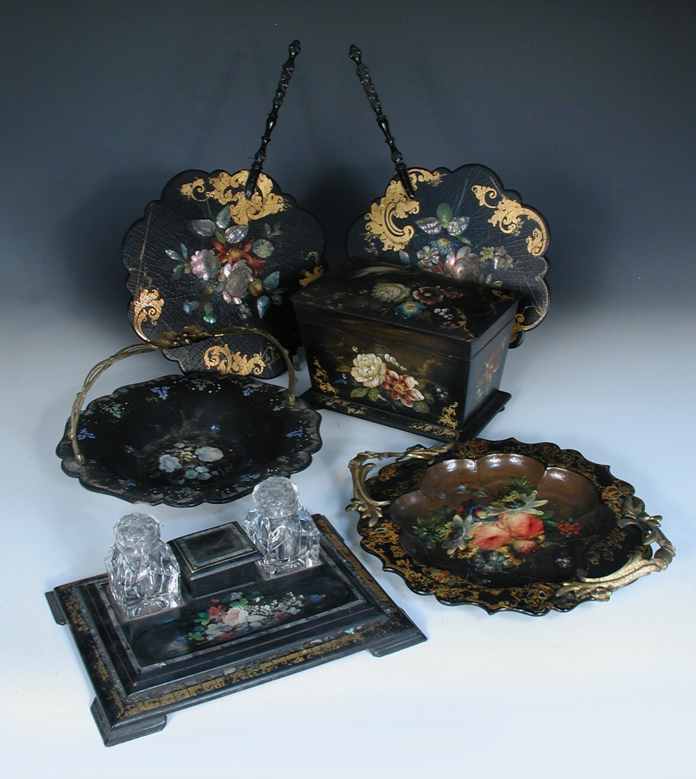 A collection of 19th century papier maché wares, comprising tea caddy, desk stand with mother-of-