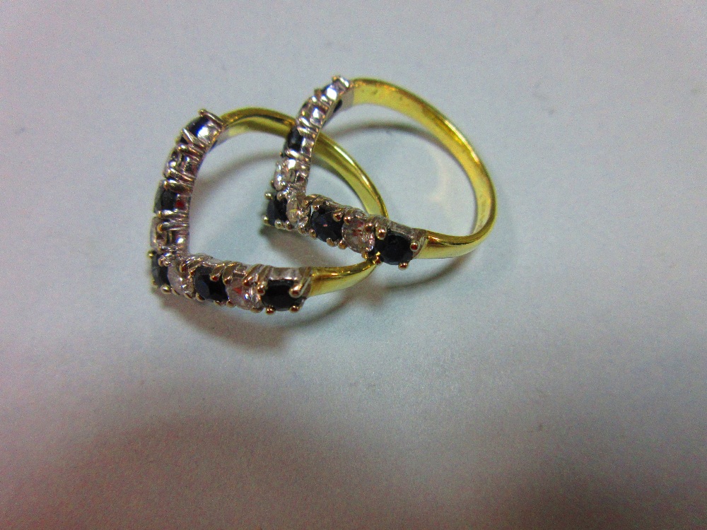 A pair of 18ct gold sapphire and diamond wishbone rings, each V set with alternating round brilliant - Image 2 of 5