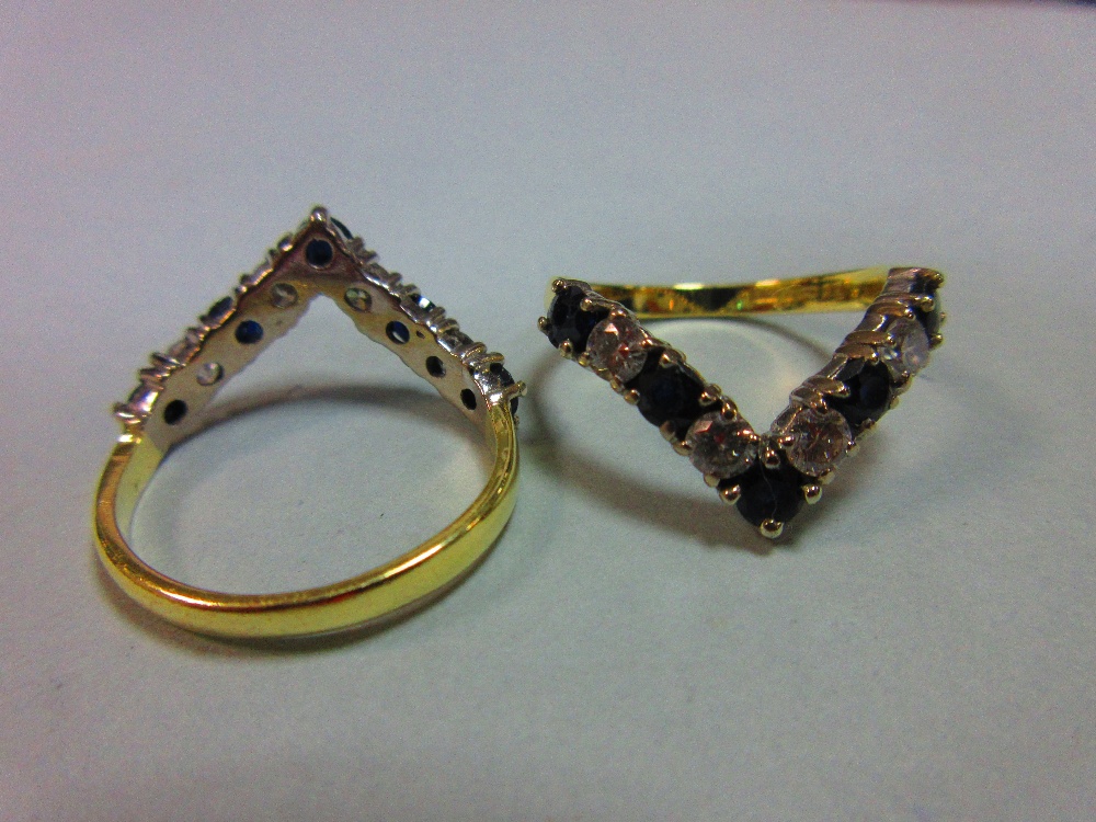 A pair of 18ct gold sapphire and diamond wishbone rings, each V set with alternating round brilliant - Image 5 of 5