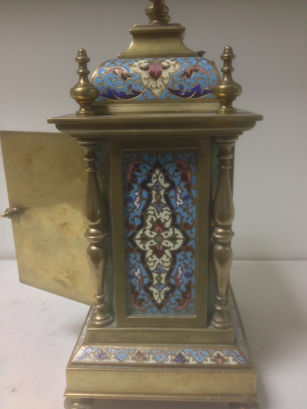 A late 19th century brass and enamelled mantle clock, with folding handle above repeat button, - Image 5 of 5