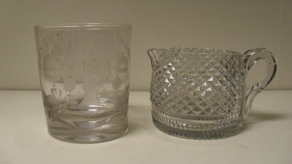 An 'Oddfellows' tumbler and a cream jug, possibly Irish, the tapering cylindrical sides of the